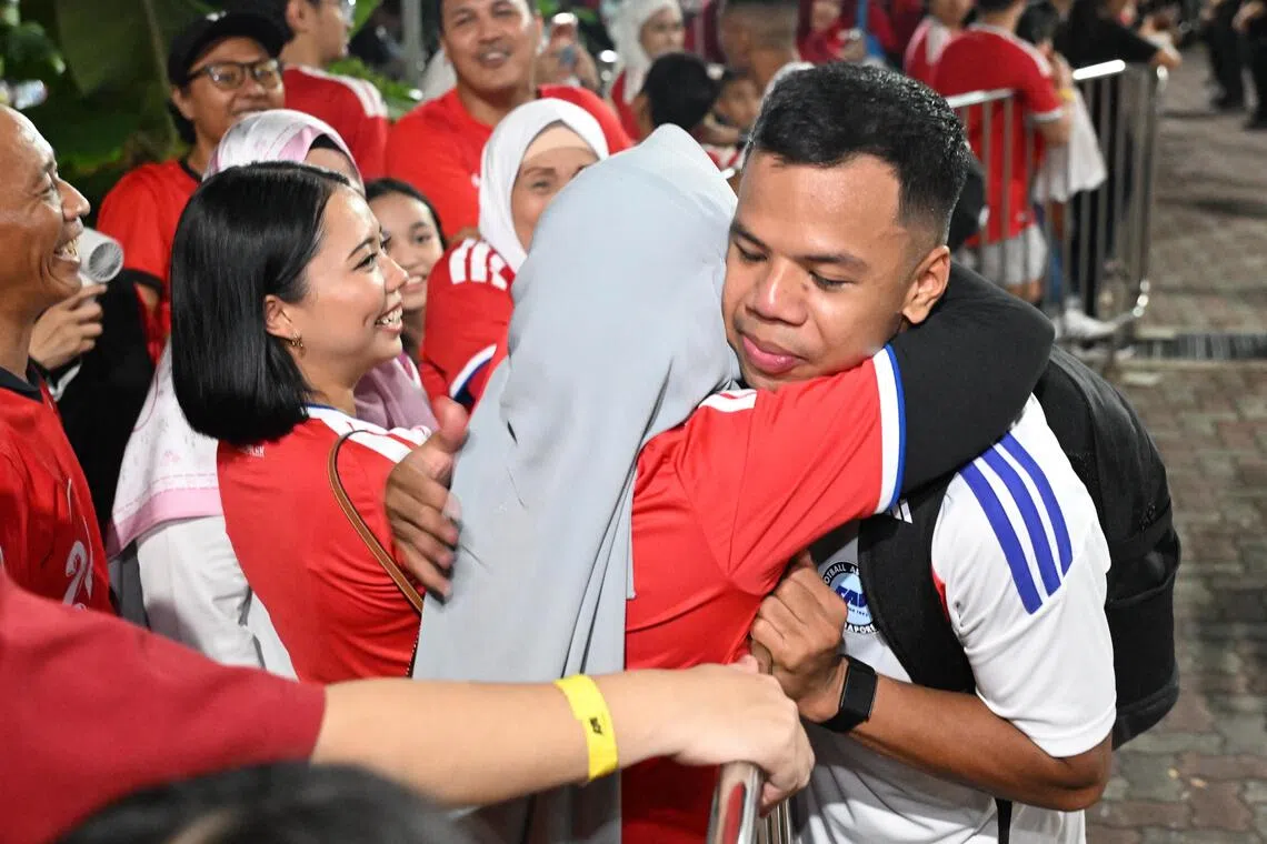 Nur Adam Abdullah hugging his mother after the ASEAN Championship semi-final first leg match at Jalan Besar Stadium on Aug 15.