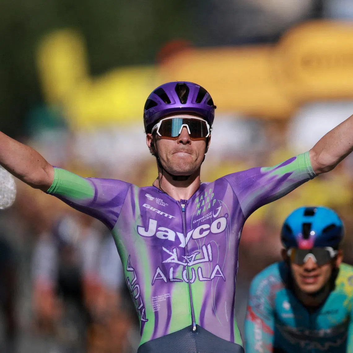 Team Jayco AlUla’s Mauro Schmid celebrates after winning Stage 13.