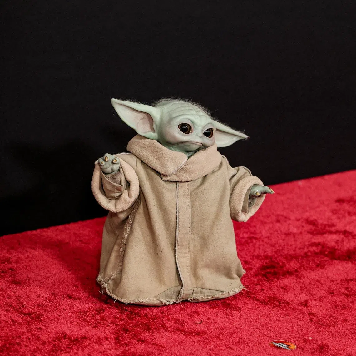 FILE PHOTO: Grogu attends a premiere for the film Star Wars: The Mandalorian and Grogu at TCL Chinese theatre in Los Angeles, California, U.S., May 14, 2026. REUTERS/Mario Anzuoni/File Photo