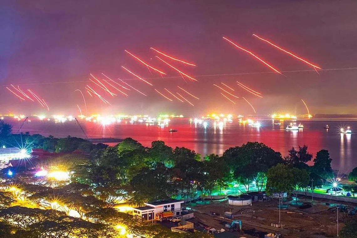 Flares fired from ships off East Coast Park at the stroke of midnight on Jan 1, 2016.