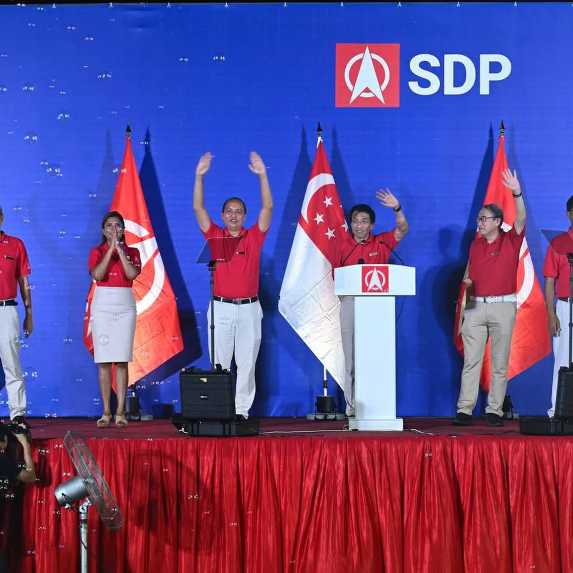 SDP chief Chee Soon Juan (third from right) and the party's candidates for Sembawang GRC (from left) Damanhuri Abas, Surayah Akbar, Bryan Lim, Alfred Tan and James Gomez at a rally on April 30.