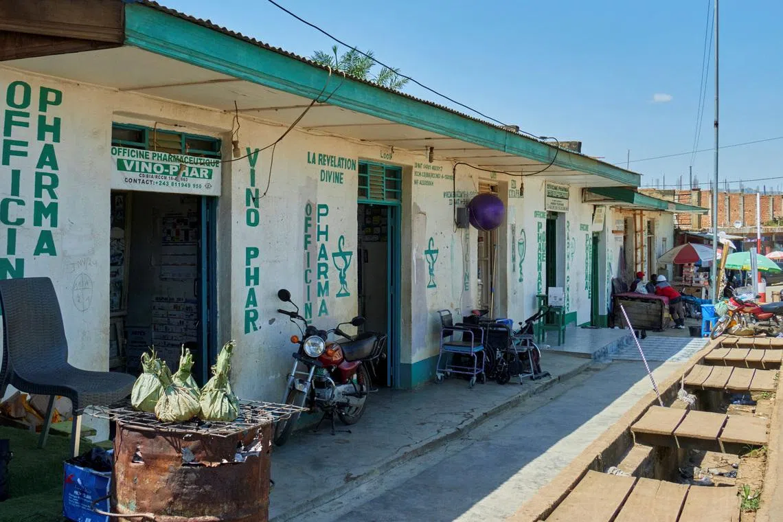 Pharmacies remain open along a street, as aid agencies intensify efforts to contain a new Ebola outbreak involving the Bundibugyo strain, in Bunia, Ituri province, Democratic Republic of Congo, May 22, 2026. REUTERS/Gradel Muyisa Mumbere