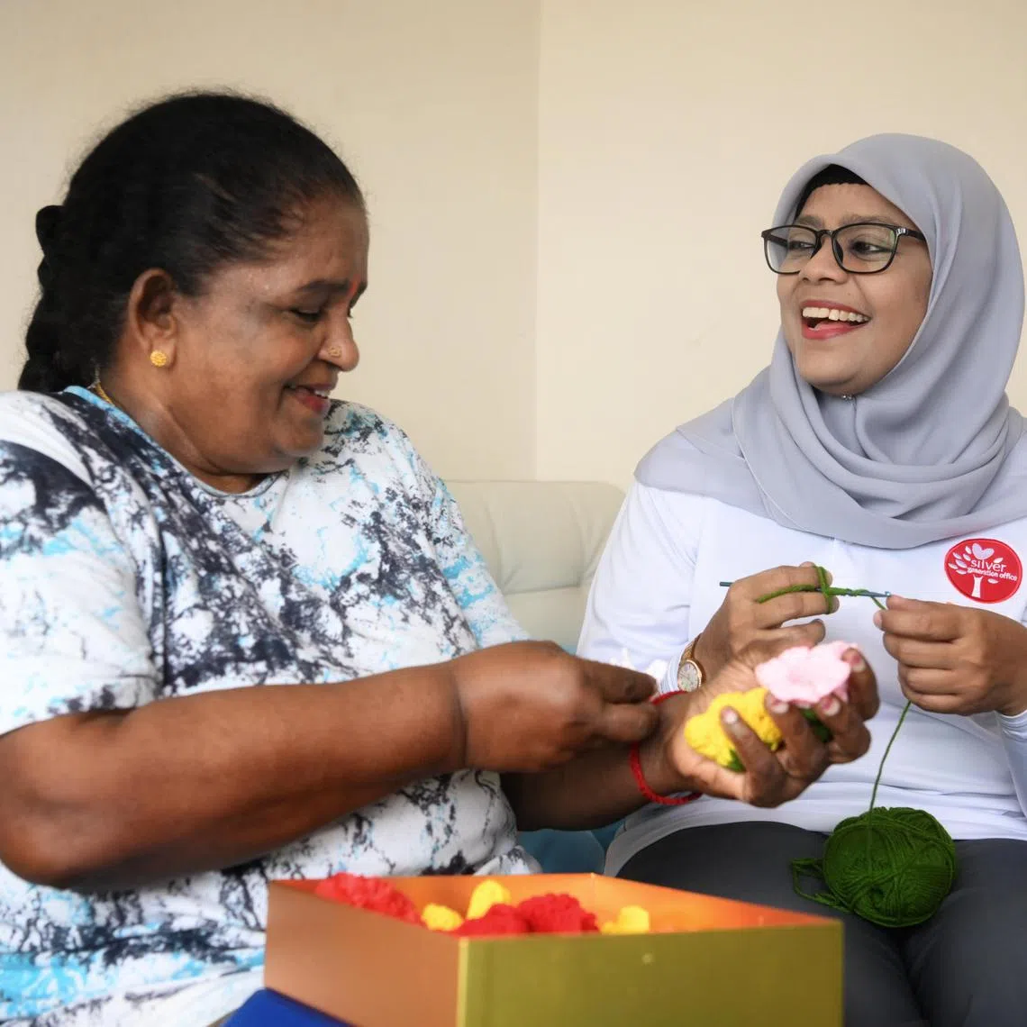 Rasul Fathima Ahmad, 53, (right)   a volunteer (Silver Generation Ambassador) with the Fernvale division engaging with a senior, Madam Nair Lachmy, 73  on December 19, 2023. 

********



Rasul Fathima Ahmad, 53, is a volunteer (Silver Generation Ambassador) with the Fernvale division. She is a keen learner and always looking for development opportunities, including Mandarin lessons to improve her ability to communicate with Mandarin-speaking seniors in her area. She us also attending a para-counselling course to help her conduct her engagements more effectively.

She was able to proactively help a senior with their Senior Support, navigating the conversations with CPF with them and supporting the senior through to a resolution in their case. The senior was very thankful for her help, as it made a real difference.

She also volunteers in other areas:
- food distribution at the mosque

She has received several awards in recognition of her efforts:
- SGA Exemplary Award 2023
- SGA Service Award (Bronze)