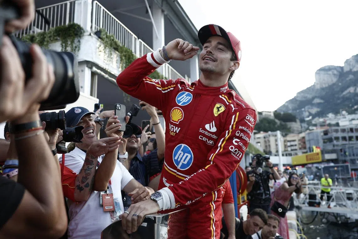 Formula One F1 - Monaco Grand Prix - Circuit de Monaco, Monaco - May 26, 2024 Ferrari's Charles Leclerc before diving into the marina after winning the Monaco Grand Prix REUTERS/Benoit Tessier/ File Photo