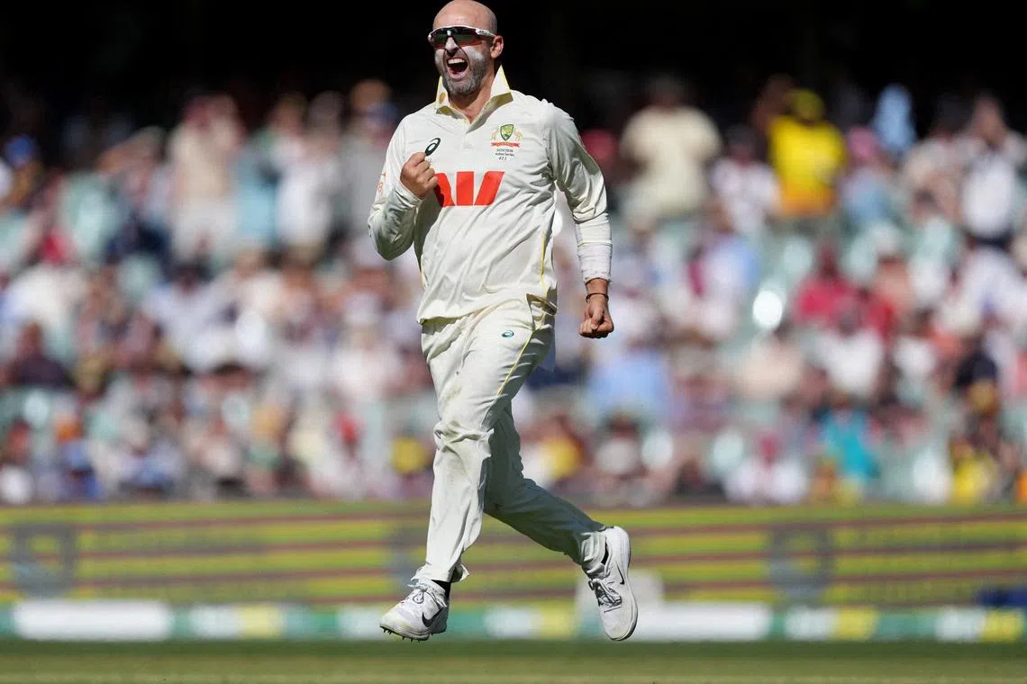 Cricket - The Ashes - Australia v England - Third Test - Adelaide Oval, Adelaide, Australia - December 20, 2025 Australia's Nathan Lyon celebrates after taking the wicket of England's Zak Crawley REUTERS/Asanka Brendon Ratnayake