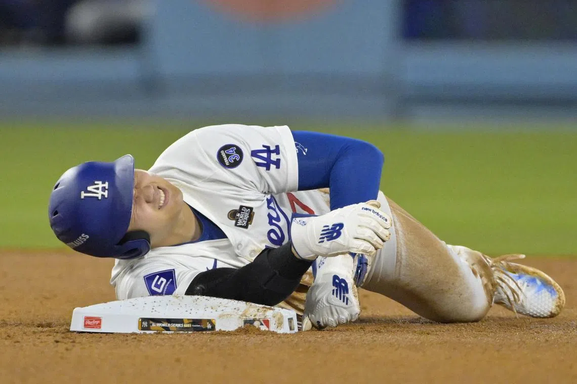 FILE PHOTO: Oct 26, 2024; Los Angeles, California, USA; Los Angeles Dodgers designated hitter Shohei Ohtani (17) reacts at second base after an apparent injury in the seventh inning against the New York Yankees during game two of the 2024 MLB World Series at Dodger Stadium. Mandatory Credit: Jayne Kamin-Oncea-Imagn Images/File Photo