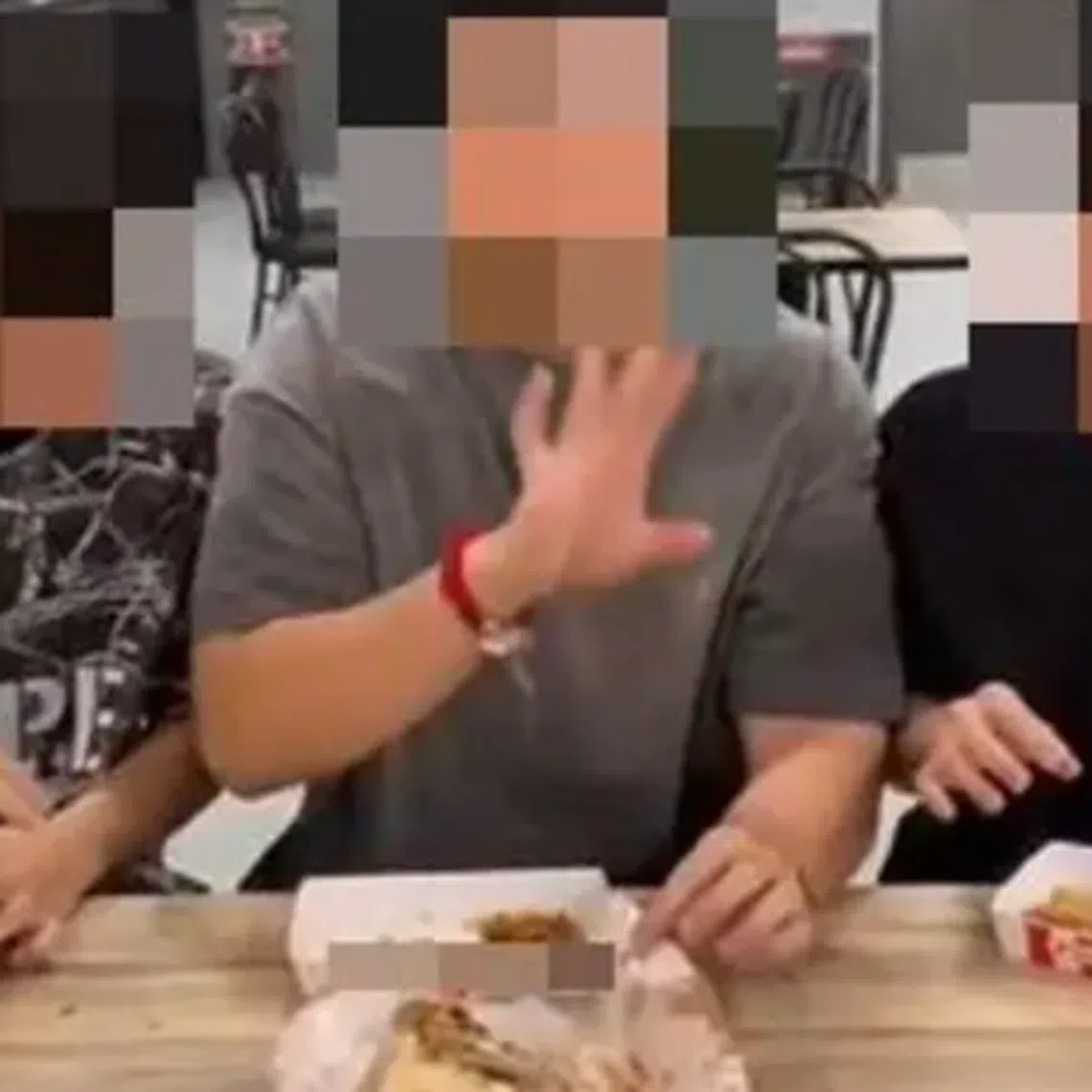 Three content creators were criticised after they filmed themselves collecting the leftover bones of chicken they ate and offering them to a homeless man.
