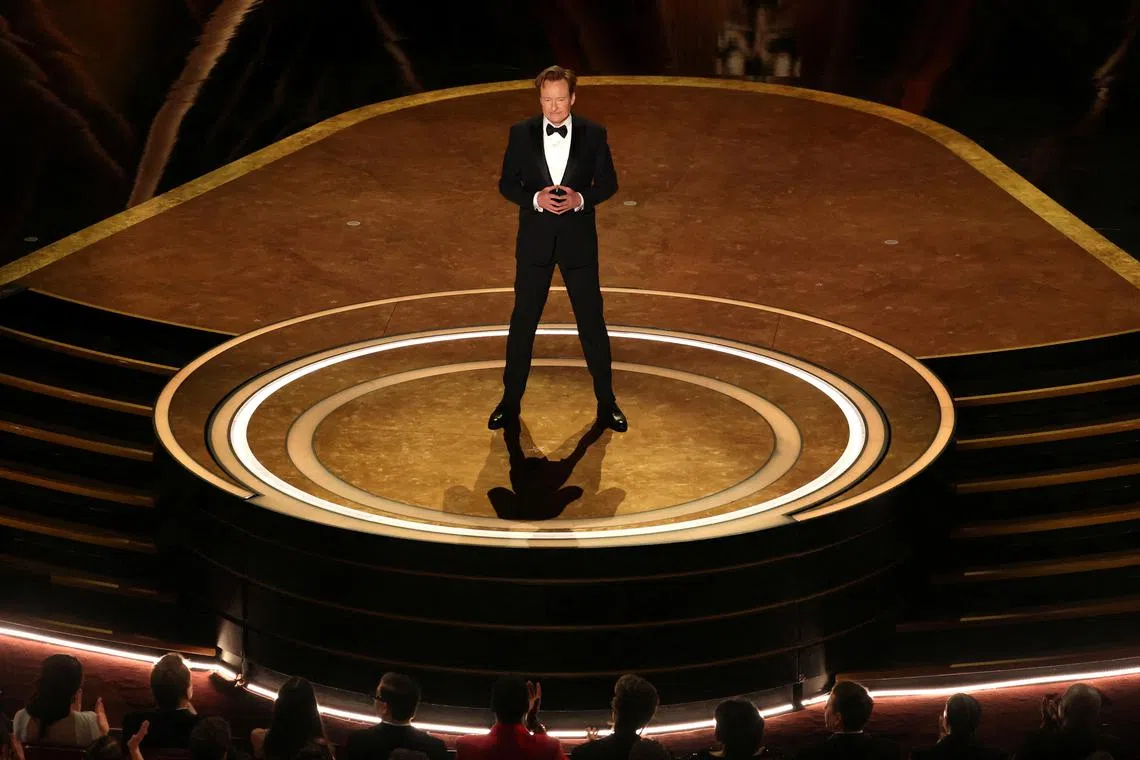 FILE PHOTO: Show host Conan O'Brien speaks during the start of the Oscars show at the 97th Academy Awards in Hollywood, Los Angeles, California, U.S., March 2, 2025. REUTERS/Carlos Barria/File Photo