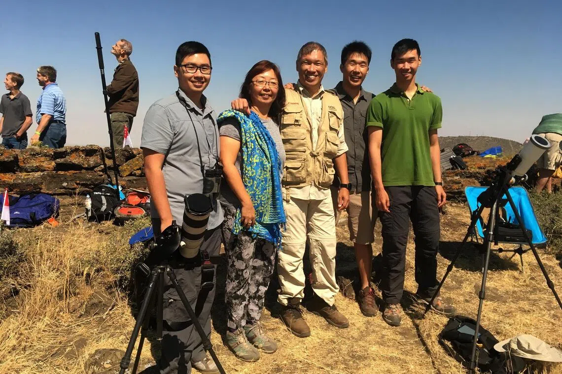The Koh family – comprising (from left) Jordon Koh, mother Janet Tay, father Koh Joo Beng, Jared Koh and Justin Koh – have spent holidays in pursuit of total solar eclipses. Here, they are on one such vacation in 2017 in Idaho in the US.