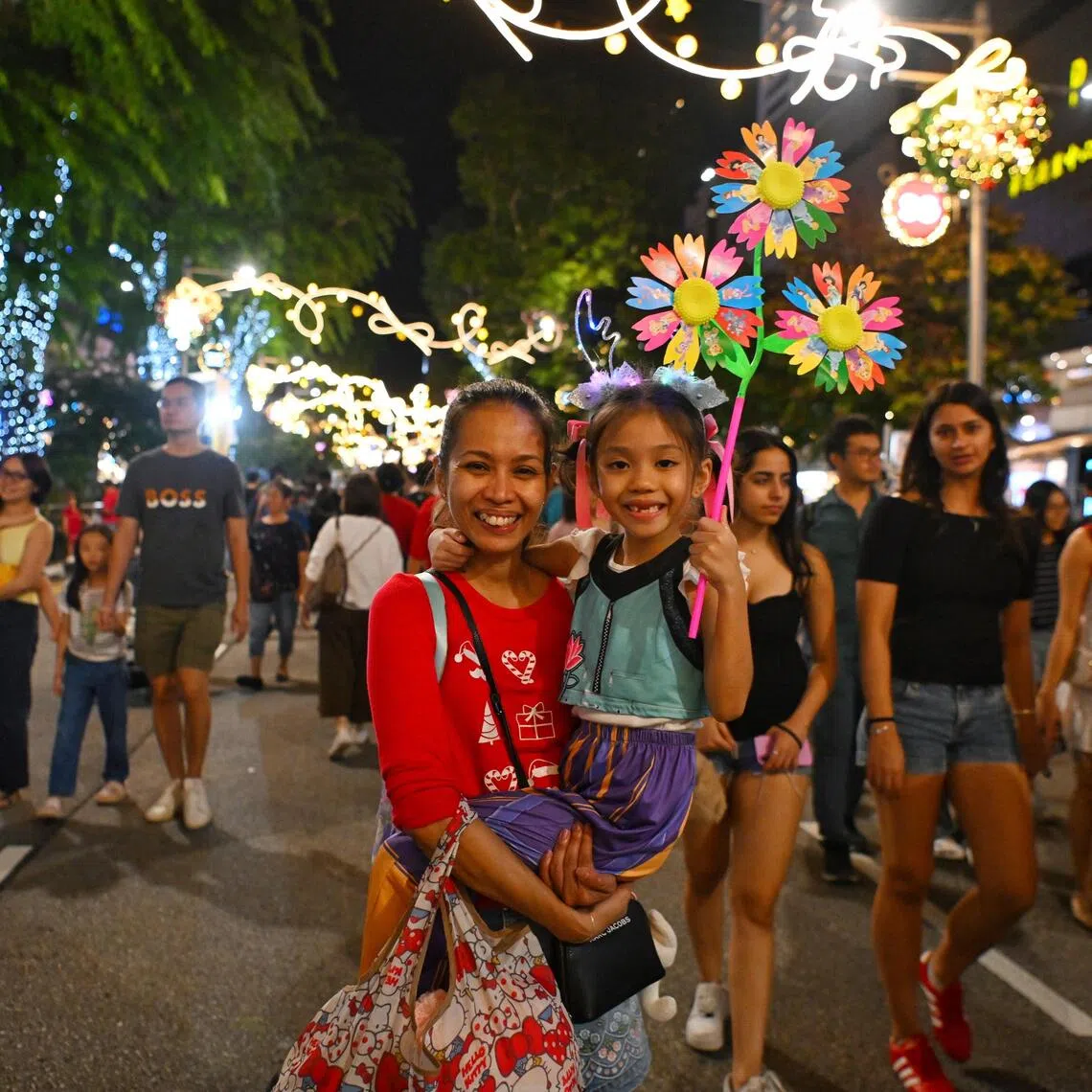 Ms Bernadette Neo, 39, a secretary, with her daughter Isabella Neo, aged seven, at the Great Christmas Eve Party on Dec 24.