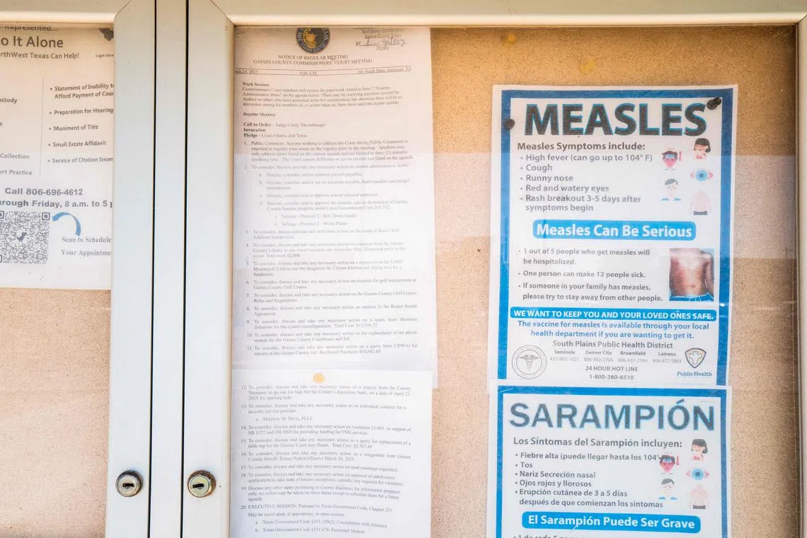 A measles advisory is shown tacked to a bulletin board outside Gaines County Courthouse on April 9 in Seminole, Texas. 