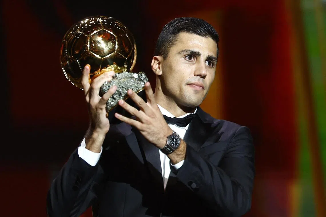 Spain's and Manchester City's Rodri with the Ballon d'Or.