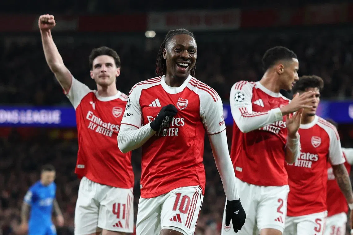 Arsenal's Eberechi Eze celebrates scoring their first goal with Declan Rice and William Saliba.