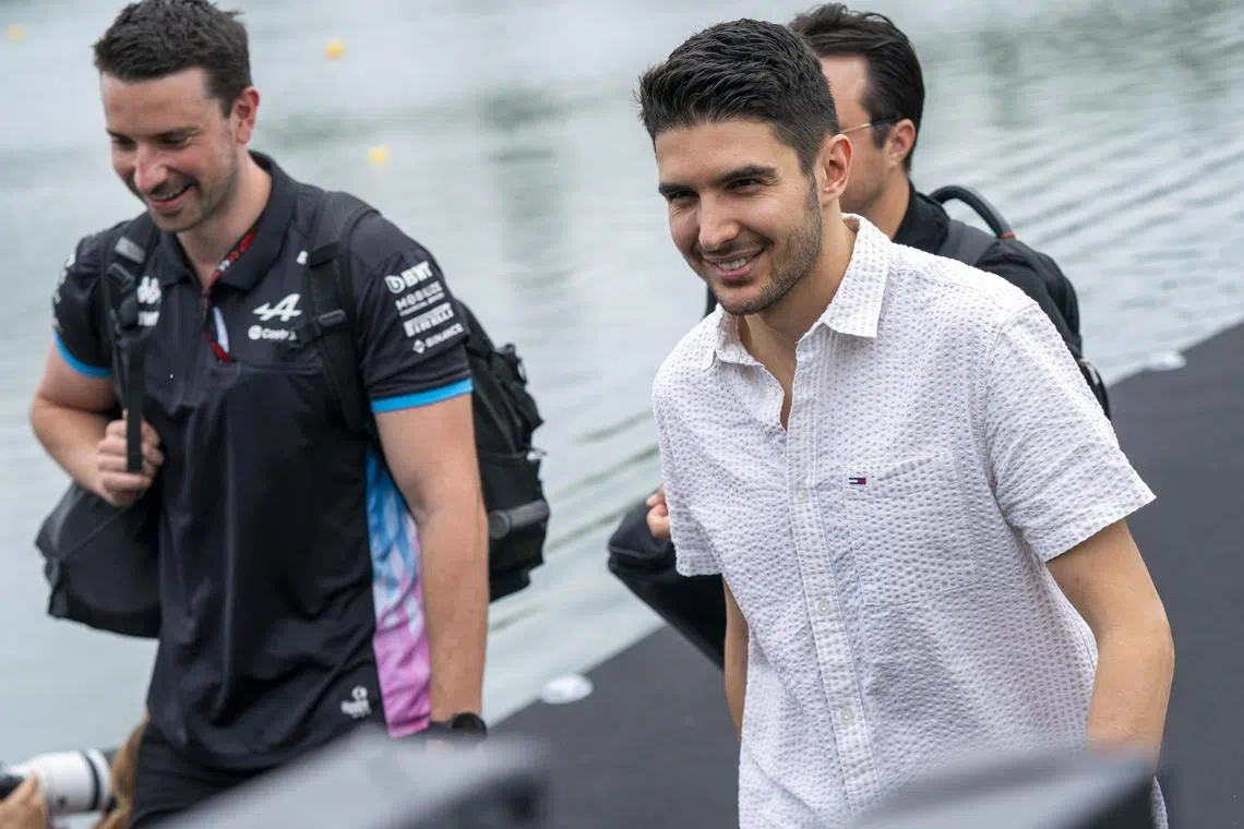 Alpine driver Esteban Ocon (right) walking to the paddock ahead of the Canadian grand prix, on June 6.