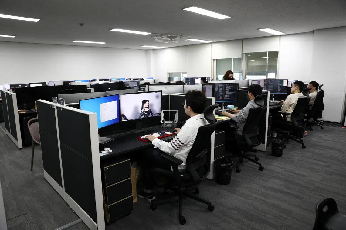 Kang Sung-ku, Head of Technical Department of Metaverse Entertainment, works on their virtual girl group MAVE in Seoul, South Korea, March 9, 2023.  REUTERS/Kim Soo-hyeon