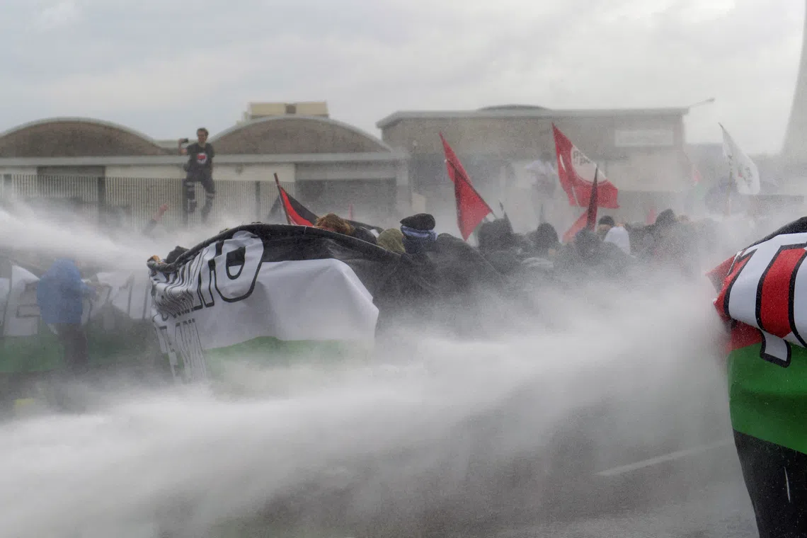 Police spraying water on protesters at a demonstration that is part of a nationwide "Let's Block Everything" protest in solidarity with Gaza, with activists also calling for a halt to arms shipments to Israel, in Venice, Italy on Sept 22, 2025. 