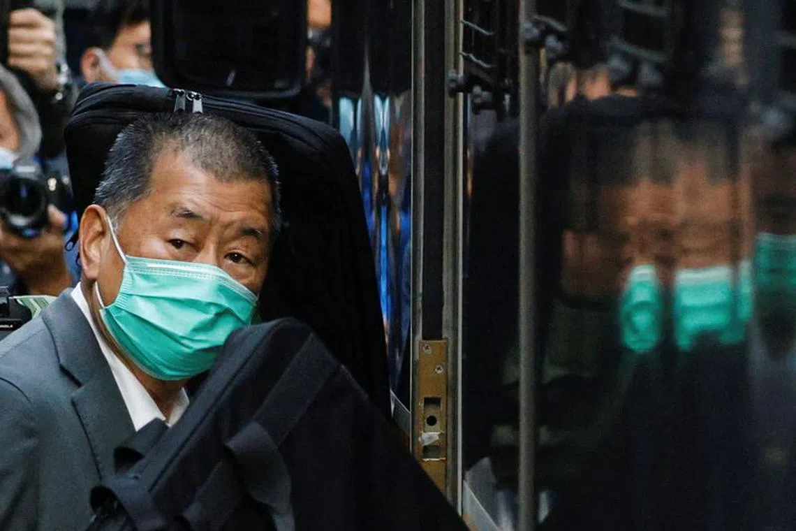 FILE PHOTO: Media tycoon Jimmy Lai, founder of Apple Daily, looks on as he leaves the Court of Final Appeal by prison van, in Hong Kong, China February 1, 2021. REUTERS/Tyrone Siu/File Photo