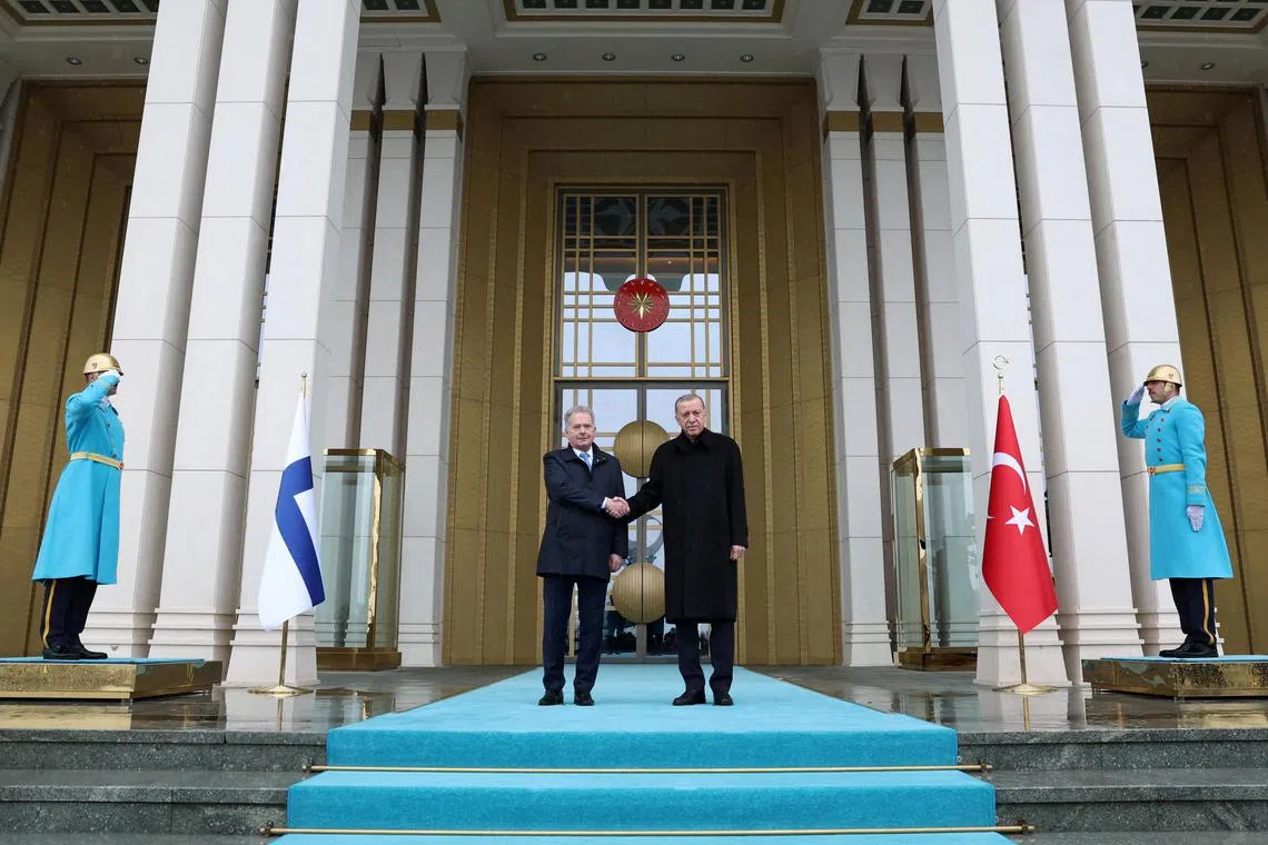 Turkey's President Tayyip Erdogan (right) welcomes Finland’s President Sauli Niinisto to Ankara, on March 17, 2023.