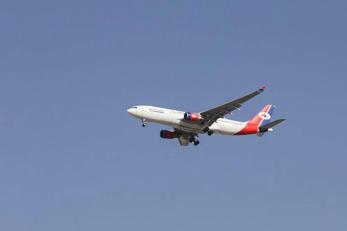 FILE PHOTO: A Yemenia-Yemen Airways Airbus A330-200 plane flies upon arrival at Sanaa Airport in Sanaa, Yemen September 30, 2023. REUTERS/Khaled Abdullah/File Photo