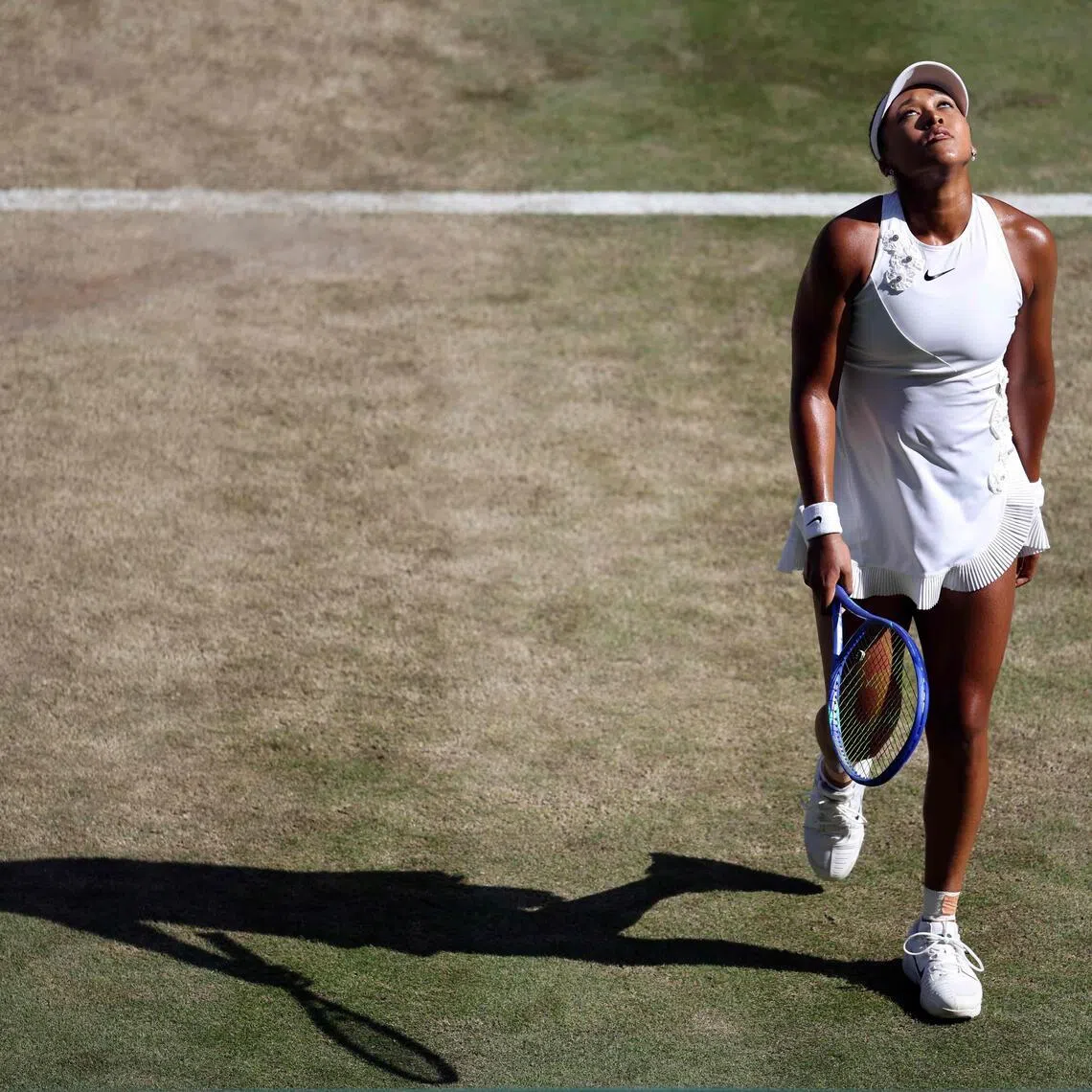 Japan's Naomi Osaka reacts as she plays against Czech Republic's Karolina Muchova during their women's singles quarter-final tennis match on the ninth day of the 2026 Wimbledon Championships at The All England Lawn Tennis and Croquet Club in Wimbledon, southwest London, on July 7, 2026. (Photo by Henry NICHOLLS / AFP) / RESTRICTED TO EDITORIAL USE