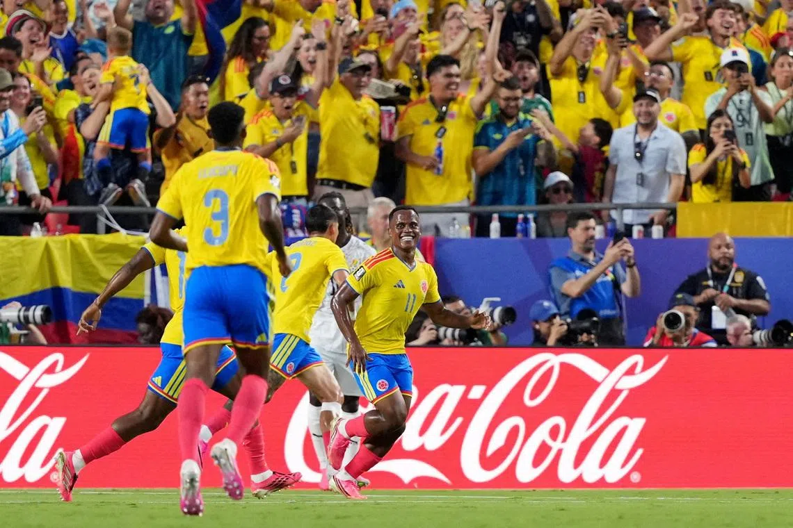 Colombia’s Jhon Arias celebrates scoring their first goal.