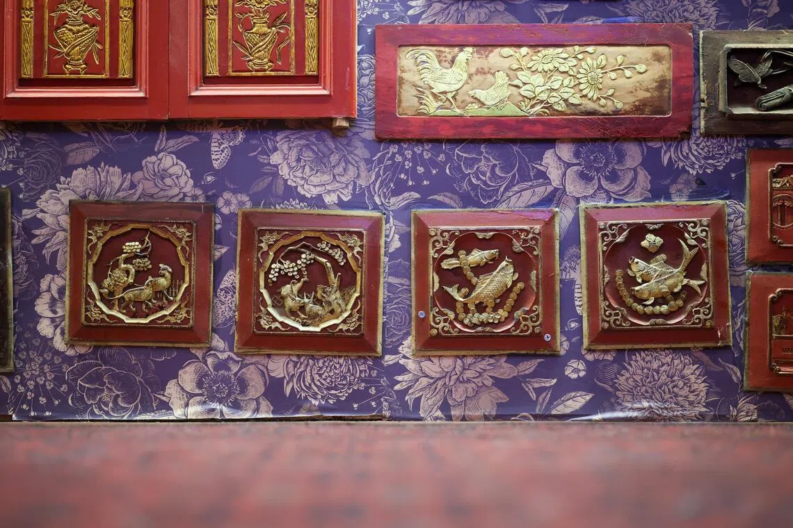 Antique bed frames at the Kebaya Bar.