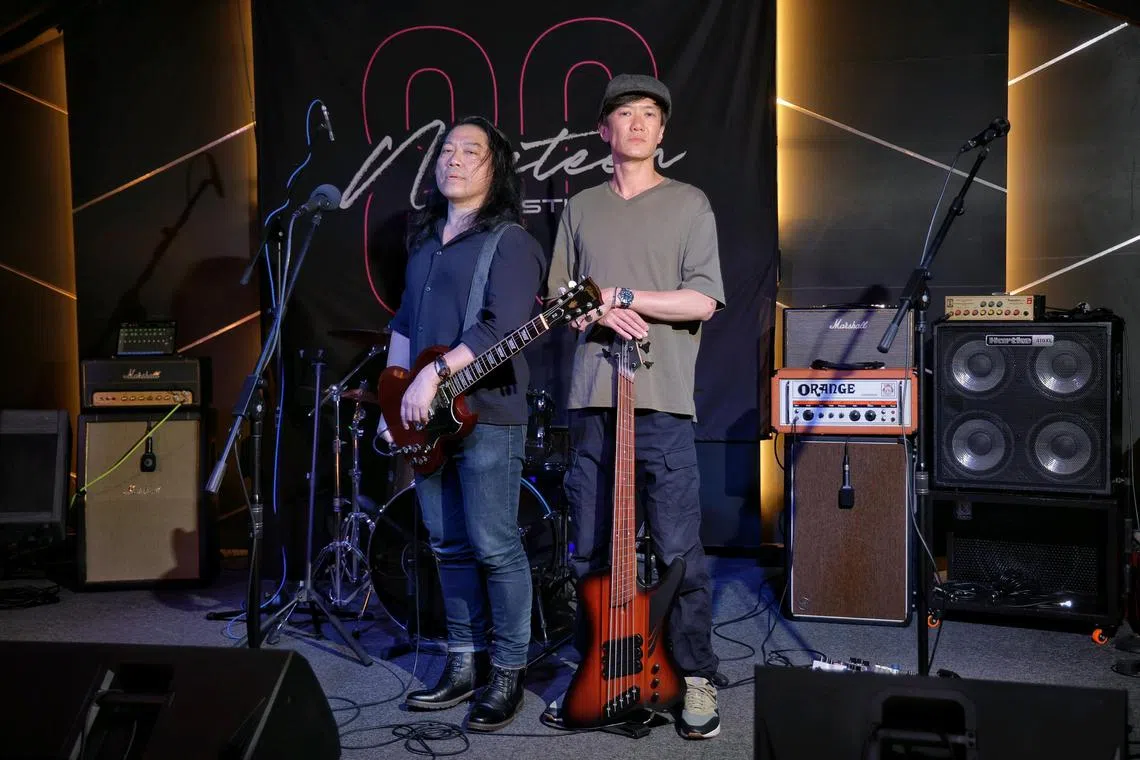(From left) There Be Wolves' lead singer and guitarist Jason Lee, 49, and bassist Jonathan Kang, 44, at Nineteen Eighty Studios on Sept 30, 2024. Jason and Jonathan are formerly bankers who have made the switch to be full-time musicians.