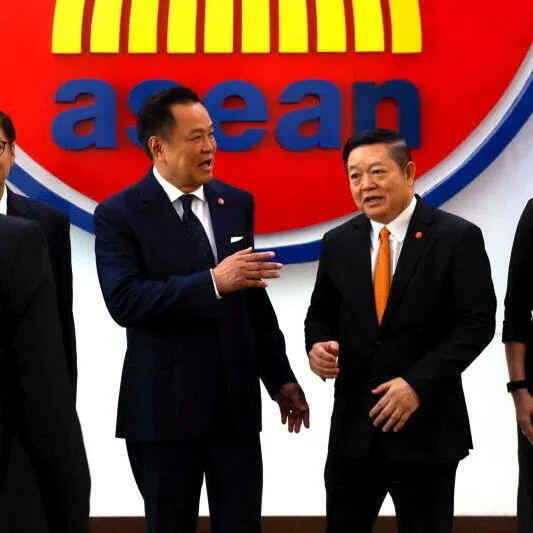 Thailand’s Prime Minister Anutin Charnvirakul (centre left) talks to ASEAN Secretary-General Kao Kim Hourn during a meeting at the ASEAN Secretariat in Jakarta.