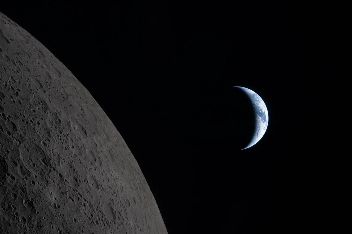 A photo from NASA shows the Earth closer to passing behind the Moon in this image captured by the Artemis II crew.