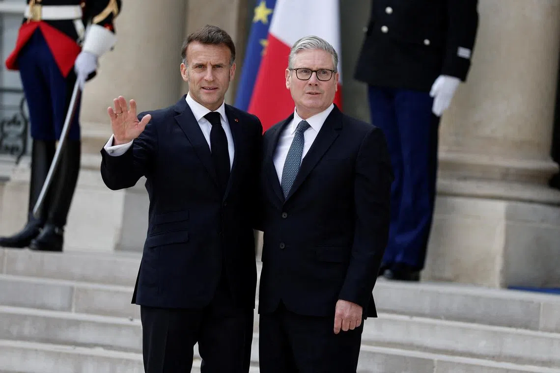 French President Emmanuel Macron welcomes Britain's Prime Minister Keir Starmer for a lunch meeting at the Elysee Palace before a video conference meeting of around 40 countries that are willing to contribute to the defensive multilateral mission to restore freedom of navigation in the Strait of Hormuz when security conditions permit, in Paris, France, April 17, 2026. REUTERS/Benoit Tessier