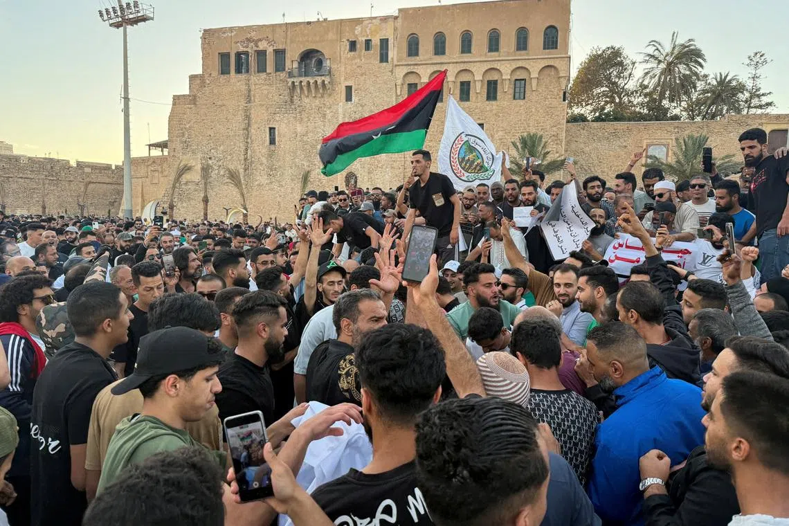 FILE PHOTO: Demonstrators demand the overthrow of the Libya's Government of National Unity headed by Abdulhamid al-Dbeibah, in Martyrs' Square in Tripoli, Libya. May 16, 2025.  REUTERS/Ayman al-Sahili/File Photo