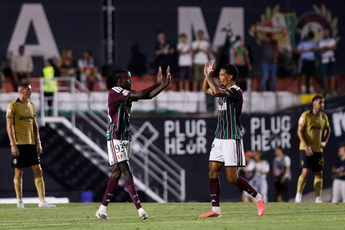 Estrela da Amadora’s French forward Benito Souza (left) celebrates scoring his team’s second goal with teammate Leandro Antonetti during the 2-2 Portuguese Primeira Liga draw with Sporting Lisbon at the Estadio Jose Gomes in Amadora on Aug 8.