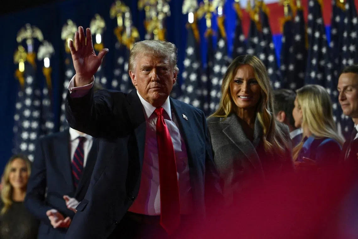 FILE PHOTO: Republican presidential nominee and former U.S. President Donald Trump waves while walking off stage following early results from the 2024 U.S. presidential election in Palm Beach County Convention Center, in West Palm Beach, Florida, U.S., November 6, 2024. REUTERS/Callaghan O'Hare/File Photo