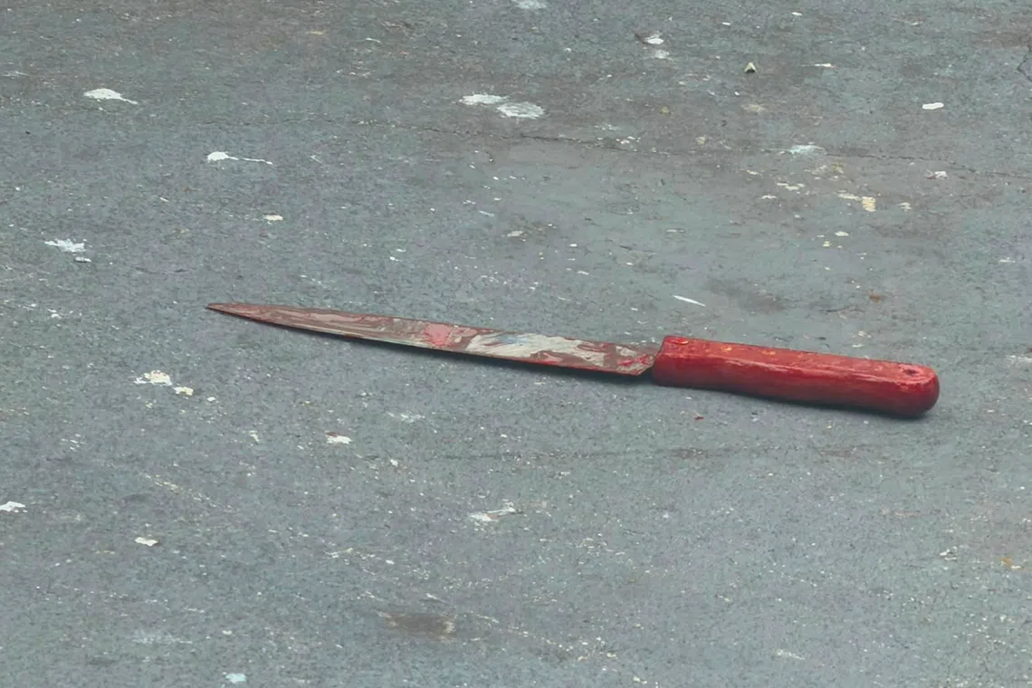 A neighbour who declined to be named said a knife was thrown from the 16th floor, landing in front of a coffeeshop.
