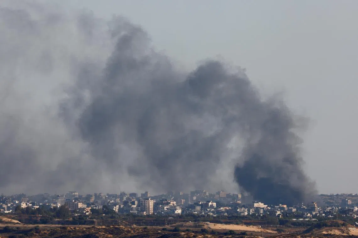 FILE PHOTO: Smoke rises following an explosion in Gaza, amid the ongoing conflict between Israel and the Palestinian Islamist group Hamas, near the Israel-Gaza border, as seen from Israel, May 30, 2024. REUTERS/Amir Cohen/File Photo