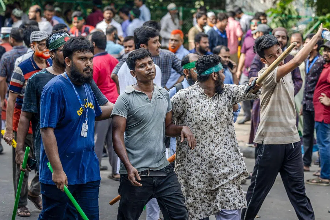 Several people the crowd suspected of being Awami League supporters were thrashed with sticks, while others were forcibly escorted away. 