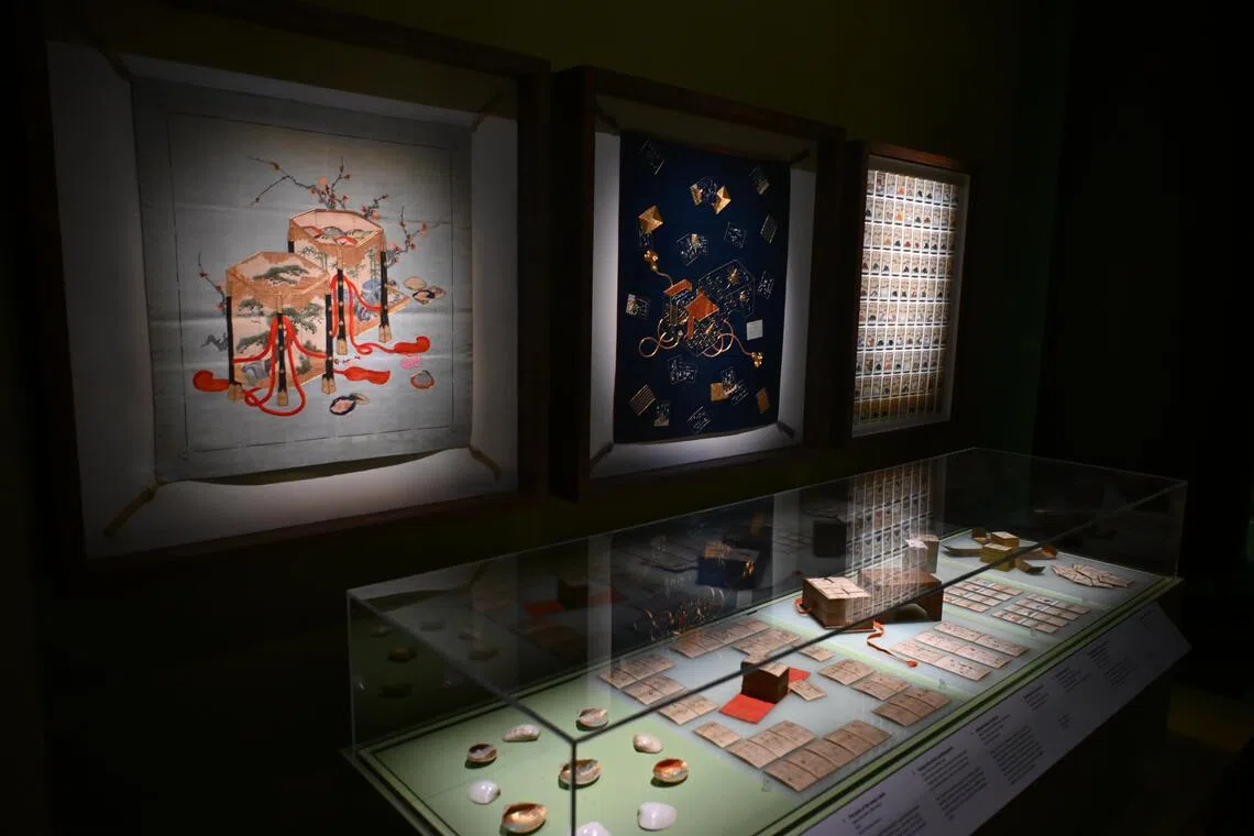 A display of a set of Hyakunin Isshu playing cards at the Asian Civilisations Museum's Let's Play.