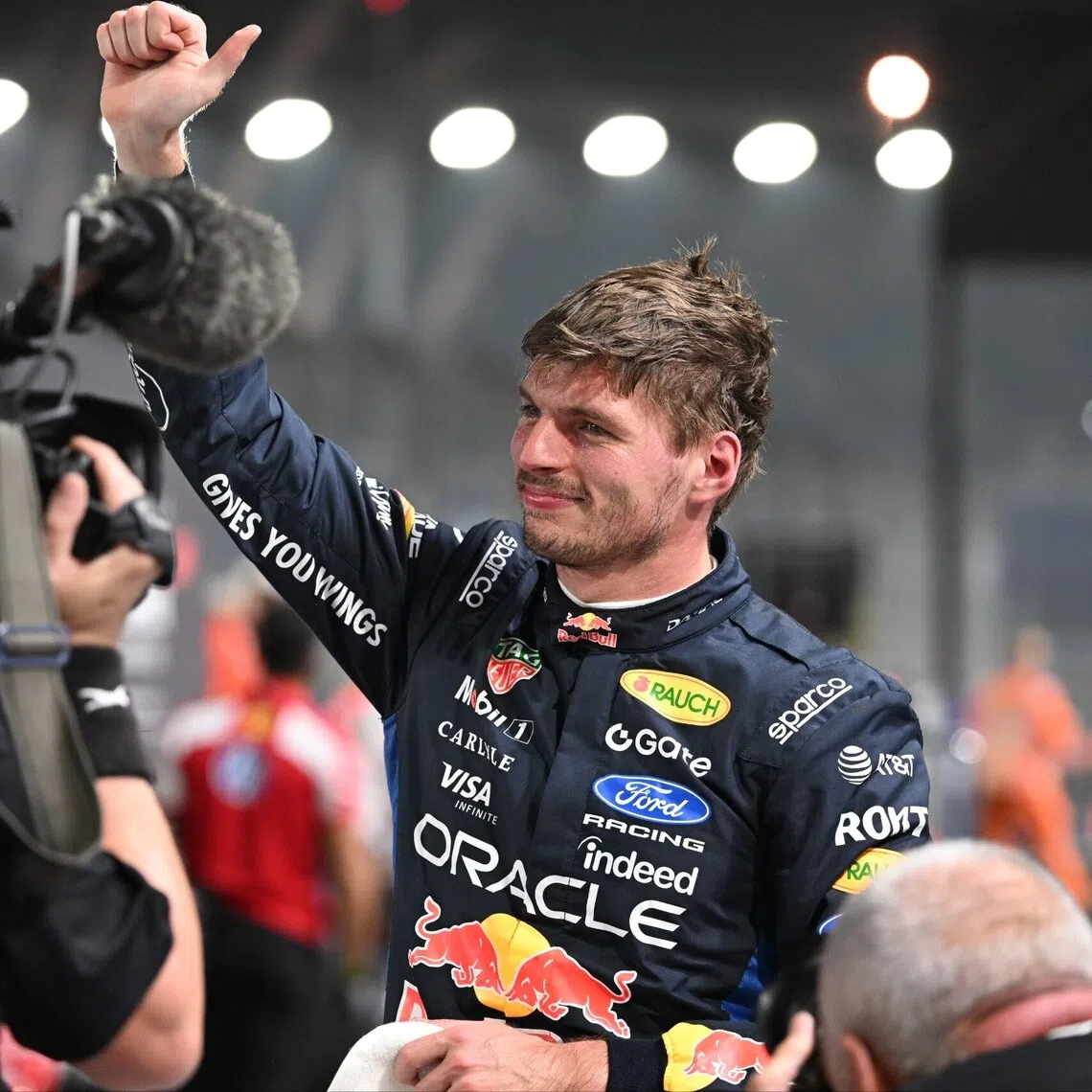 Red Bull’s Max Verstappen celebrating taking pole position for the Singapore Grand Prix on Oct 10 at the Marina Bay Street Circuit.