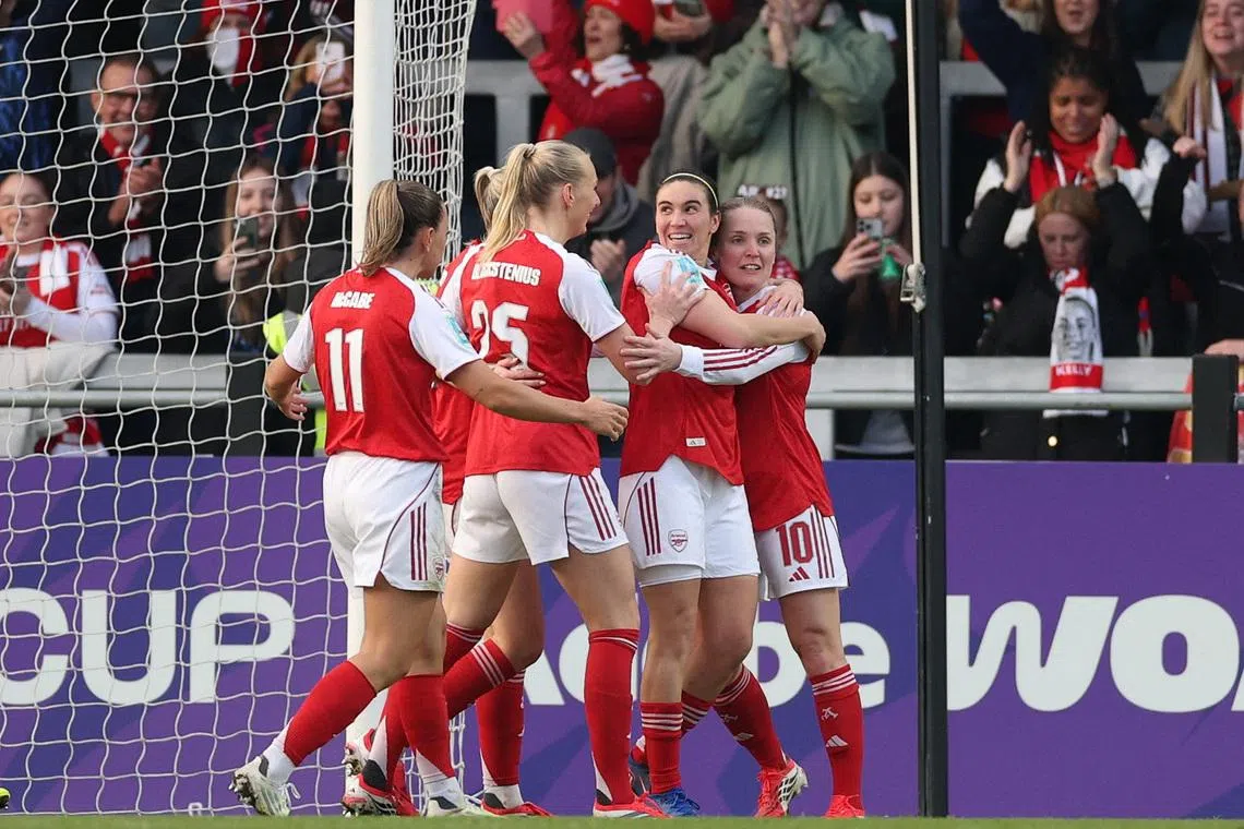 FILE PHOTO: Soccer Football - Women's FA Cup - Fourth Round - Arsenal v Aston Villa - Meadow Park, Borehamwood, Britain - January 18, 2026 Arsenal's Stina Blackstenius celebrates scoring their first goal with teammates Action Images via Reuters/John Sibley/File Photo