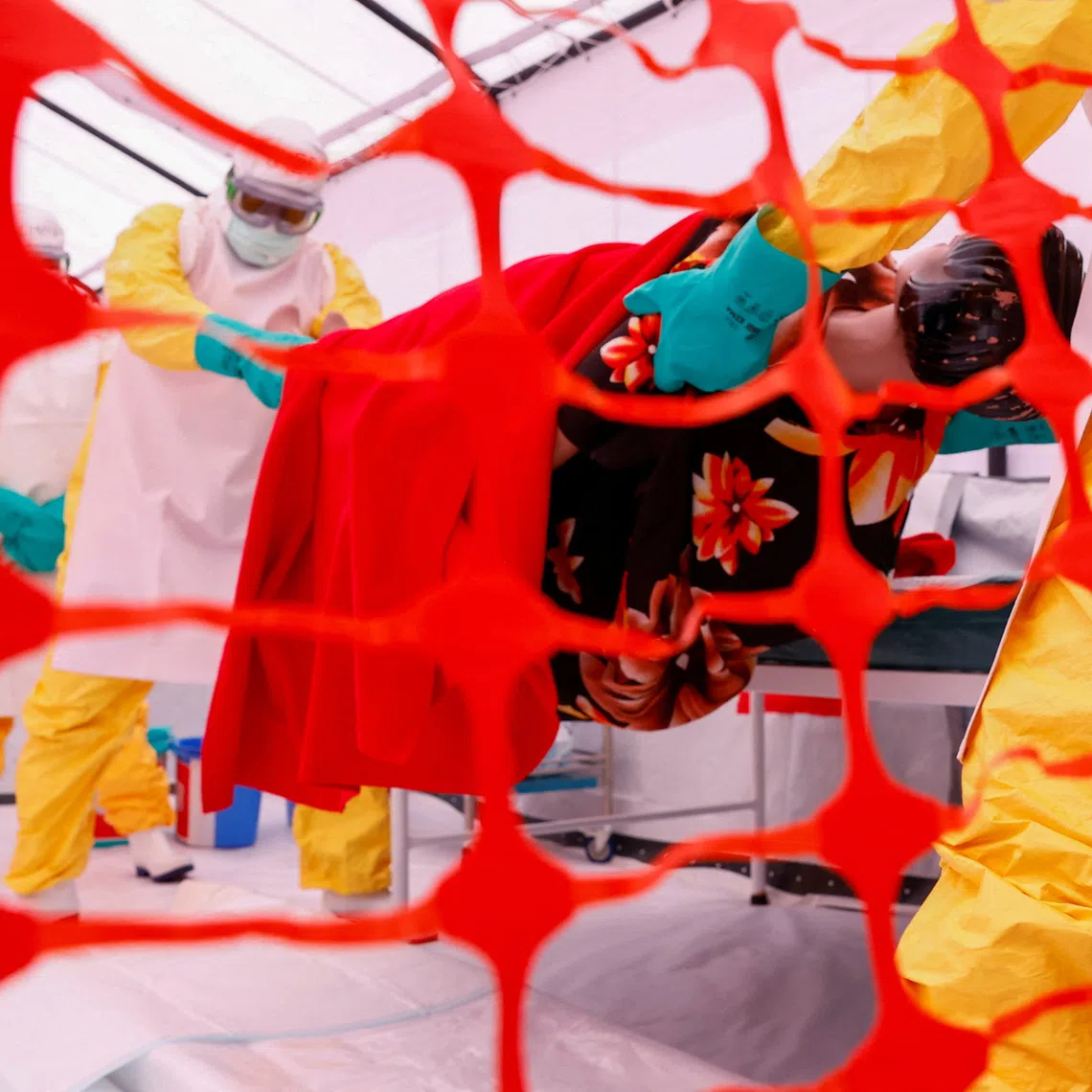 Health workers attend a training for personnel preparing to reinforce regional Ebola response capacity in the Democratic Republic of Congo.