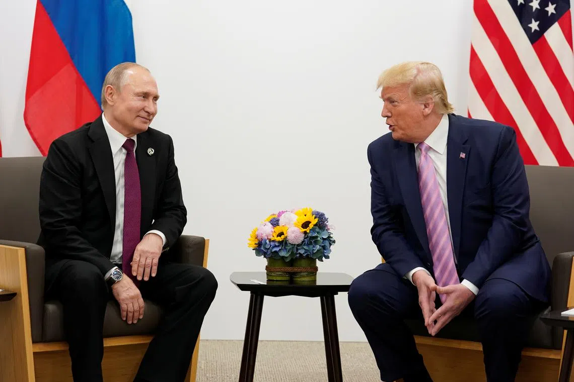 Russia's President Vladimir Putin and U.S. President Donald Trump talk during a bilateral meeting at the G20 leaders summit in Osaka, Japan, June 28, 2019.  REUTERS/Kevin Lamarque/File Photo