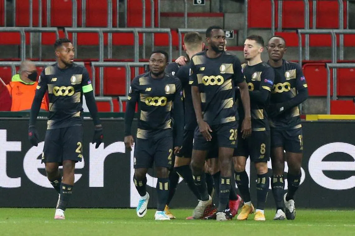 Soccer Football - Europa League - Group D - Standard Liege v Benfica - Stade Maurice Dufrasne, Liege, Belgium - December 10, 2020 Standard Liege's Abdoul Tapsoba celebrates scoring their second goal with teammates REUTERS/Francois Walschaerts/File Photo
