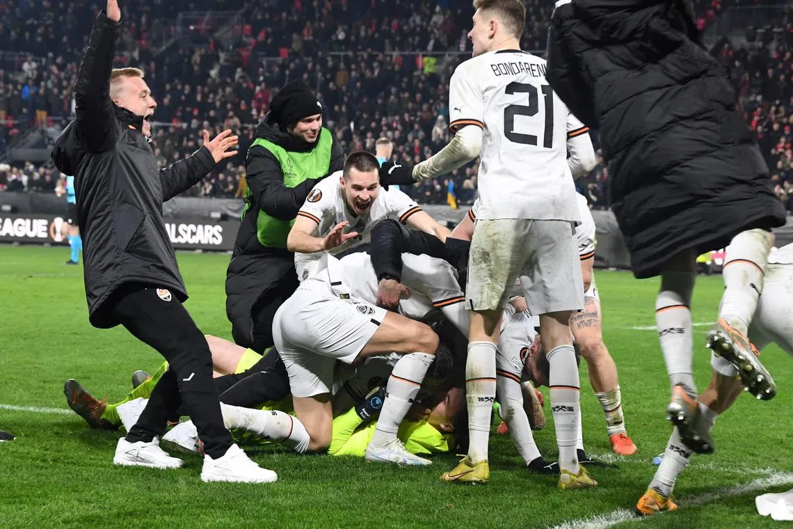 Shakhtar's players celebrating after winning the Europa League play-off second-leg match against Rennes at the Roazhon Park stadium.