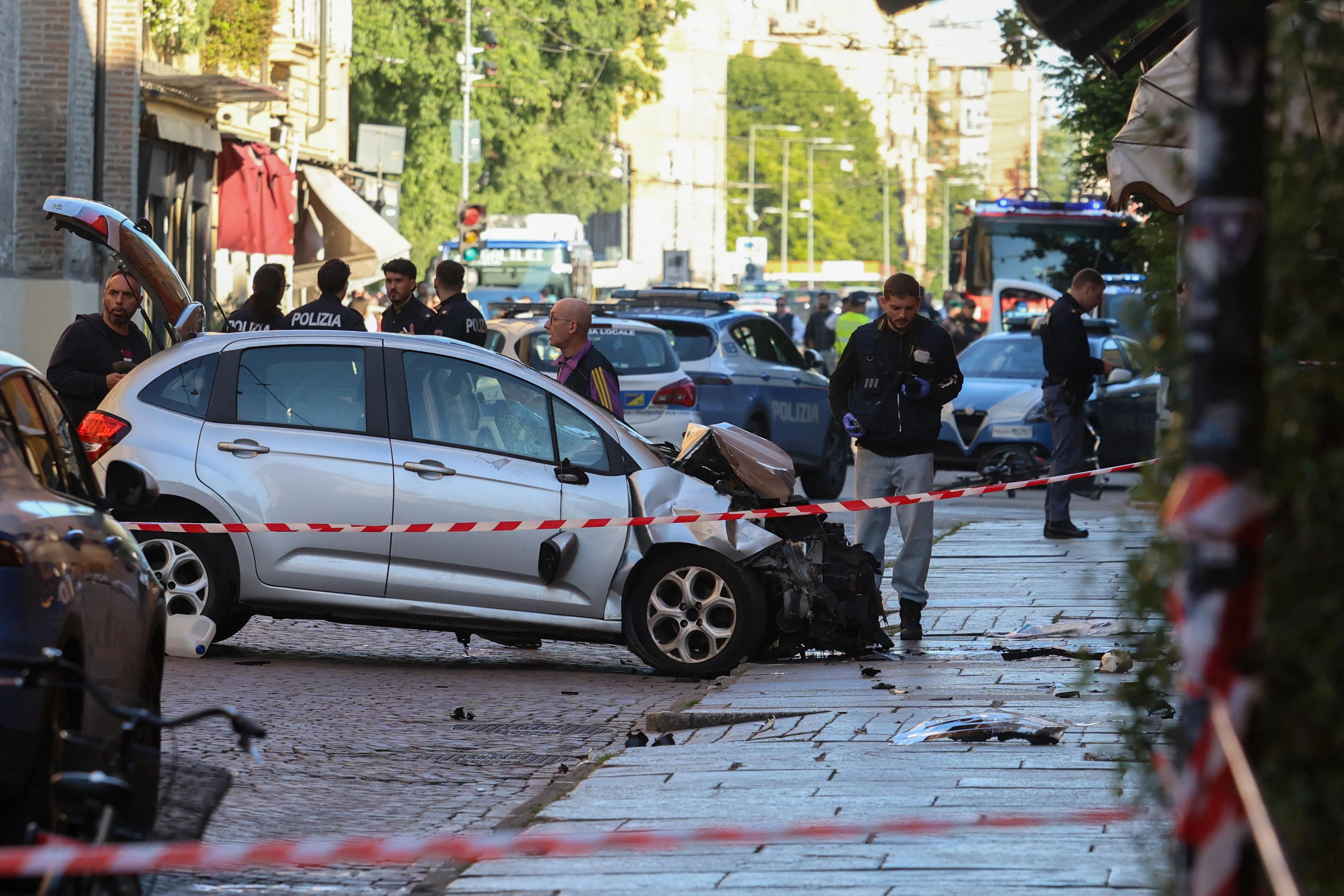 The driver crashed the car into a shop window and then tried to flee before being stopped by pedestrians, one of whom he attacked with a knife.