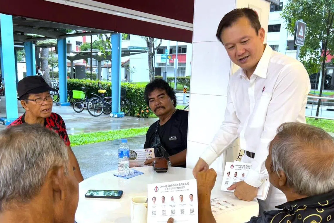 PAP's Jurong East-Bukit Batok GRC candidate Lee Hong Chuang on a coffeeshop walkabout at 324 Bukit Batok St 33 on April 26.