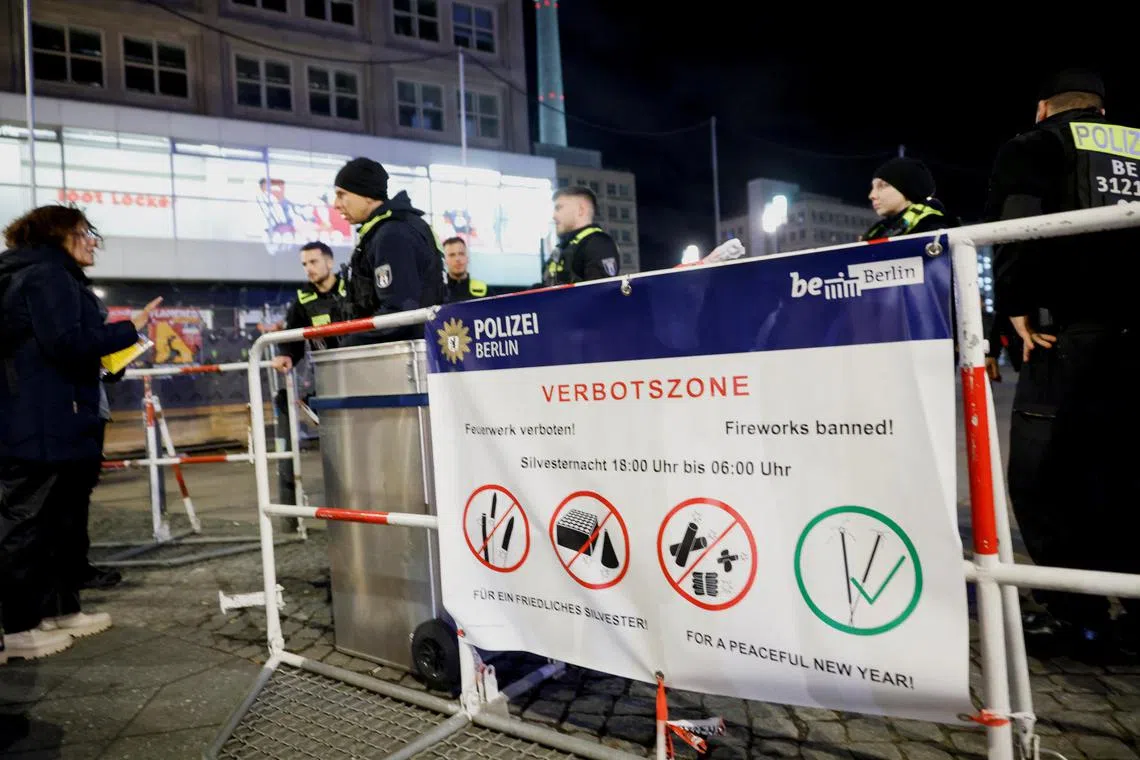 Dozens of people were injured as young men lobbed firecrackers and started fires in the streets of Berlin on New Year's Eve.
