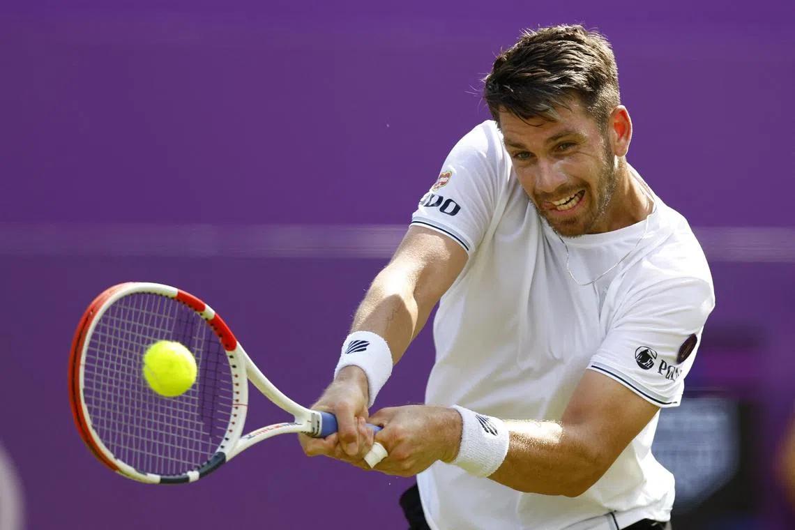 Britain's Cameron Norrie in action during his round of 16 match against Australia's Jordan Thompson at the Queen's Club championships. 