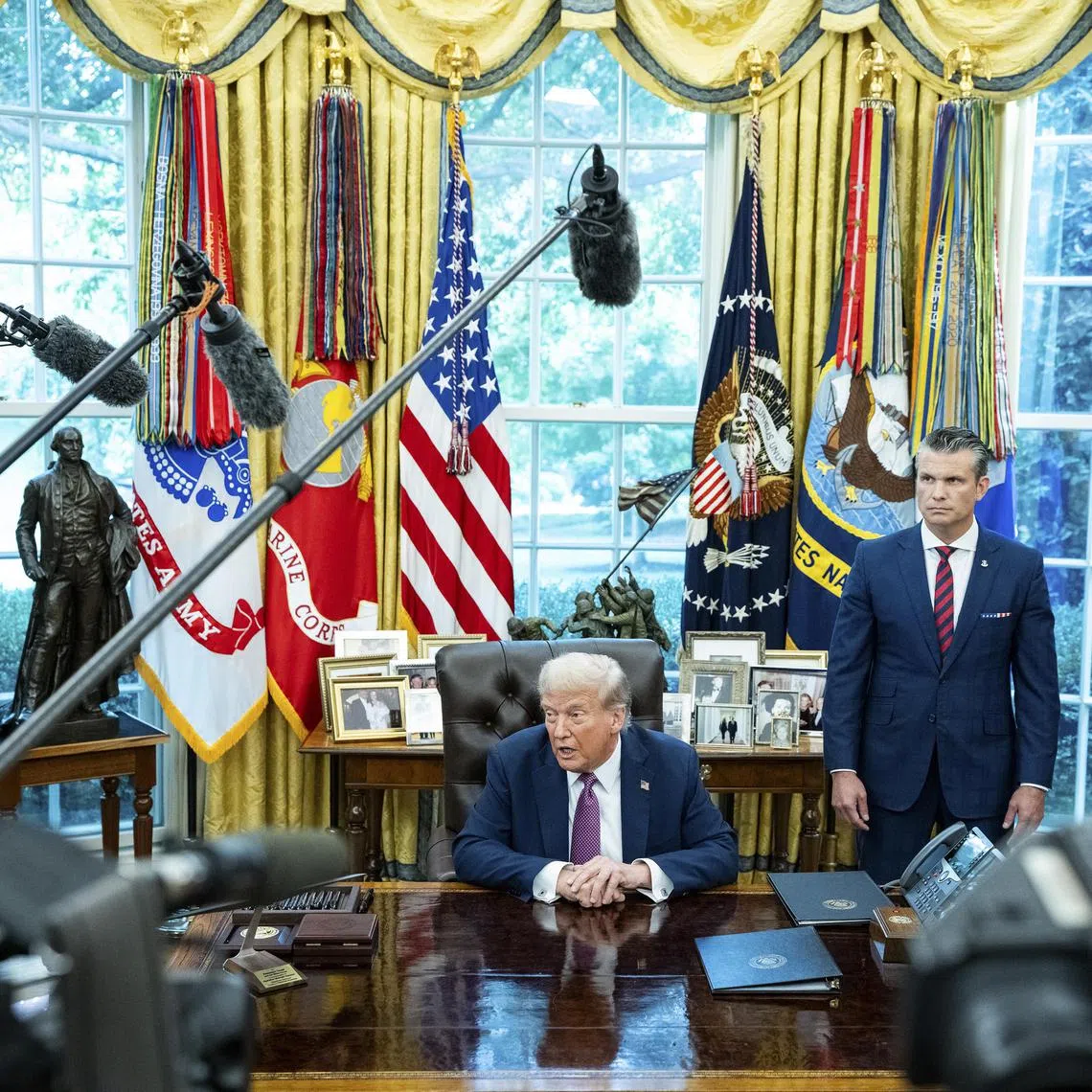 US President Donald Trump in the Oval Office with (from right) General Dan Caine, Chairman of the Joint Chiefs of Staff, and Secretary of Defence Pete Hegseth on Sept 5.