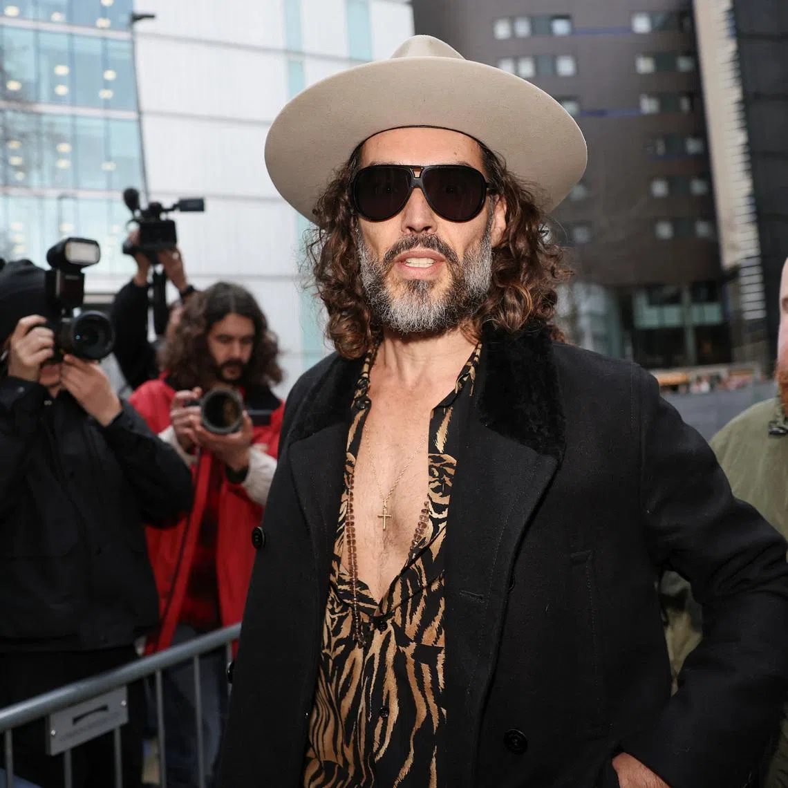 British actor and comedian Russell Brand arrives at Southwark Crown Court after further charges were added to his rape and multiple sexual assault case, in London, Britain, February 24, 2026. REUTERS/Toby Melville