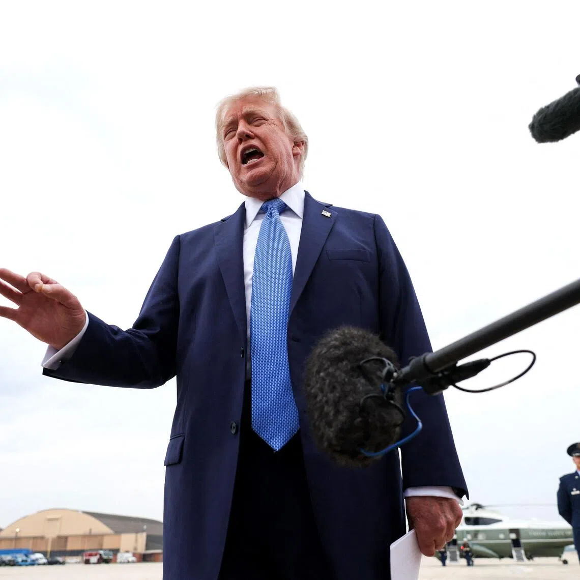 US President Donald Trump speaking to reporters before boarding Air Force One on Aug 14, at Joint Base Andrews, Maryland.